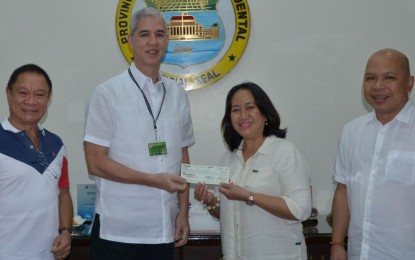 Negros Occidental turns over nearly P5-M crop insurance fund to PCIC CROP INSURANCE. Negros Occidental Governor Eugenio Jose Lacson (2nd from left) turns over the PHP4.92-million check to Philippine Crop Insurance Corp. Regional Manager Eva Laud during their meeting at the Provincial Capitol on Thursday (October 10, 2019). The amount is the provincial government’s additional allocation for farmers’ premiums. The event was witnessed by Jose Ma. Torres (right), head of PCIC-Negros Occidental, and Provincial Agriculturist Japhet Masculino (left). Photo courtesy of PIO Negros Occidental