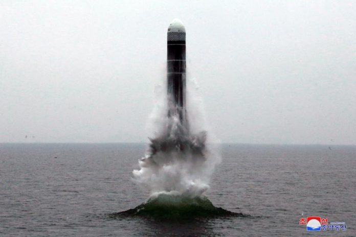 What appears to be a submarine-launched ballistic missile flies in an undisclosed location in this undated picture released by North Korea’s Central News Agency on Oct. 2. KCNA VIA REUTERS