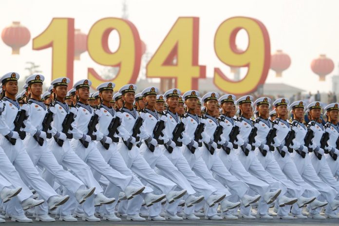 People’s Liberation Army Soldiers of the People’s Liberation Army march past Tiananmen Square during a rehearsal before a military parade marking the 70th founding anniversary of People’s Republic of China in Beijing on Oct. 1. REUTERS/THOMAS PETER
