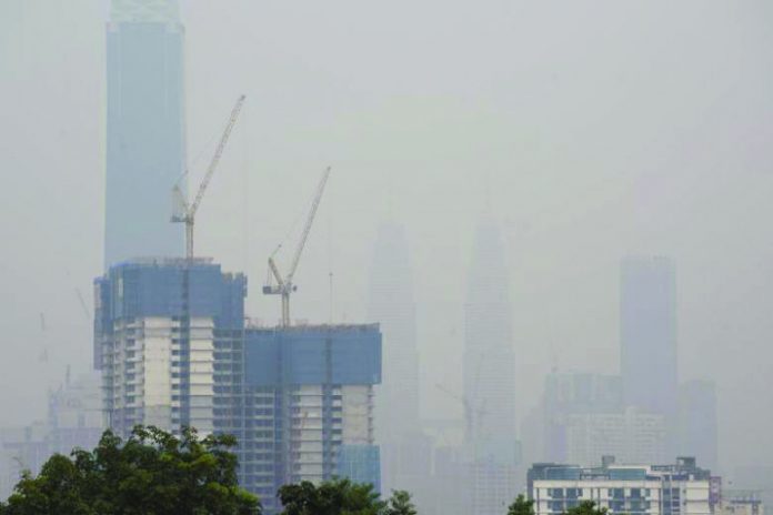 Petronas Twin Towers Haze is seen shrouding the Petronas Twin Towers in Kuala Lumpur on Sept 14. AFP
