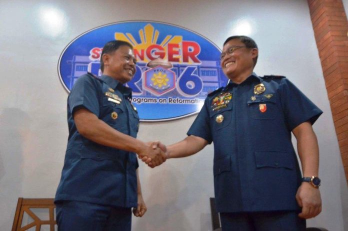 Police Lieutenant Colonel Jovie Espenido Brigadier General Rene Pamuspusan LAW ENFORCERS. Controversial Police Lieutenant Colonel Jovie Espenido (left) is welcomed to the Police Regional Office 6 by Brigadier General Rene Pamuspusan, Western Visayas police director. Espenido has been designated deputy city director for operations of the Bacolod City Police Office. His main task is to run after drug traffickers. IAN PAUL CORDERO/PN