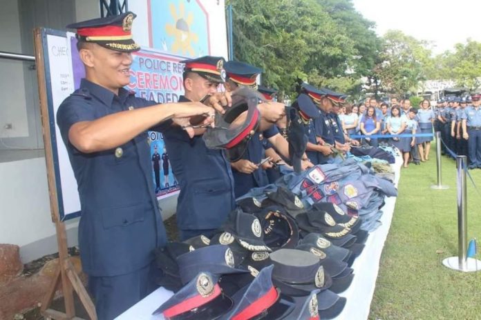 GOODBYE, OLD UNIFORMS. Police officials shred old, faded and worn out police uniforms in Camp Delgado, headquarters of the Police Regional Office 6 in Iloilo City. The destruction yesterday, Oc. 28, 2019, ensured that the uniforms would not be used by civilians who are prohibited by law from wearing police or military outfits. IAN PAUL CORDERO/PN