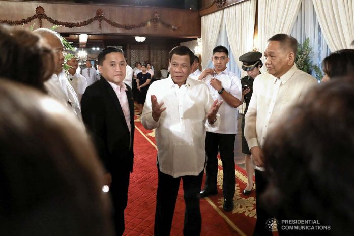 President Rodrigo Duterte President Rodrigo Roa Duterte discusses matters with newly appointed Supreme Court Chief Justice Diosdado Peralta following the oath-taking ceremony at the Malacañan Palace on October 24, 2019. PCOO