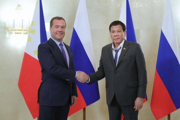 President Rodrigo Duterte Russian Prime Minister Dmitry Medvedev shakes hands with President Rodrigo Duterte (right) prior to their meeting in Moscow, Russia on Wednesday. AFP