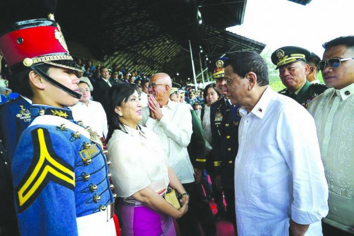 President Rodrigo Duterte and Vice President Leni Robredo President Rodrigo Duterte shares a light moment with Vice President Leni Robredo on the sidelines of the commencement exercises of the Philippine Military Academy at Fort General Gregorio Del Pilar in Baguio City on May 26, 2019. ABS-CBN NEWS