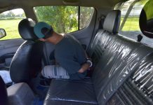 Pavia buy-bust nets 13 sachets of ‘shabu’ Ramil Abilo sits handcuffed inside a police car after he was arrested in an entrapment operation in Barangay Cabugao Sur, Pavia, Iloilo on Friday. IAN PAUL CORDERO/PN