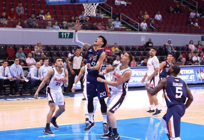 Raymond Almazan Meralco Bolts’ Raymond Almazan easily scores inside after eluding the defense of Alaska Aces’ Joachim Thoss. PBA MEDIA GROUP PHOTO