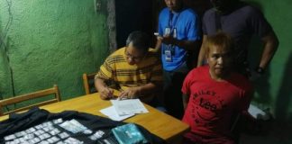 Drug suspect Rene Tobongbanua (seated on the right) was arrested in an entrapment operation in Barangay Mansilingan, Bacolod City on Oct. 16. BACOLOD CITY POLICE OFFICE STATION