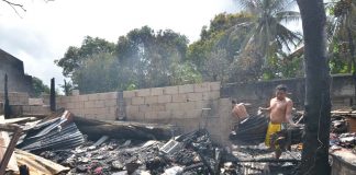 This man tries to salvage anything of value after fire gutted their house in Barangay Sambag, Jaro district early morning on Tuesday. IAN PAUL CORDERO/PN
