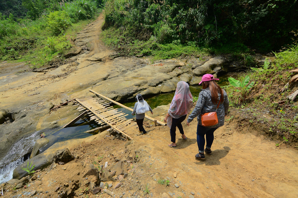 Crossing this bamboo bridge is a balancing act