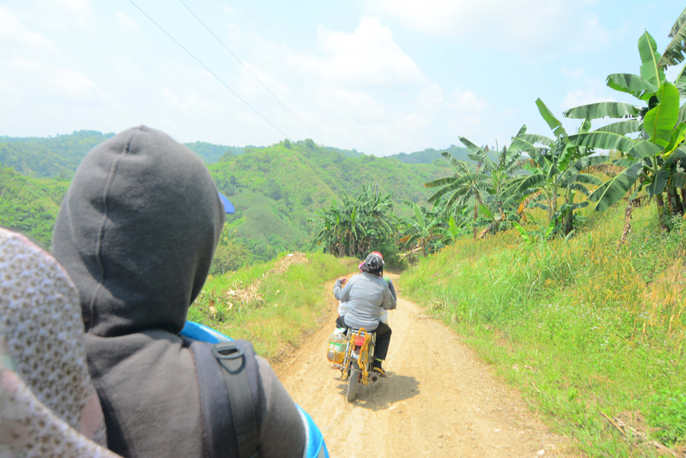 A ‘habal-habal’ (single motorcycle) makes the ascent to Barangay Tagangihin a little faster if not easier.
