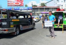 BUSINESS AS USUAL. An Iloilo City passenger jeepney ignores a protester seeking support to Monday’s (Sept. 30, 2019) one-day nationwide transport strike. The Iloilo City government says it was business as usual in this southern metropolis and the strike was hardly felt. The transport holiday was a protest against the phase out of old jeepneys by July 2020. IAN PAUL CORDERO/PN