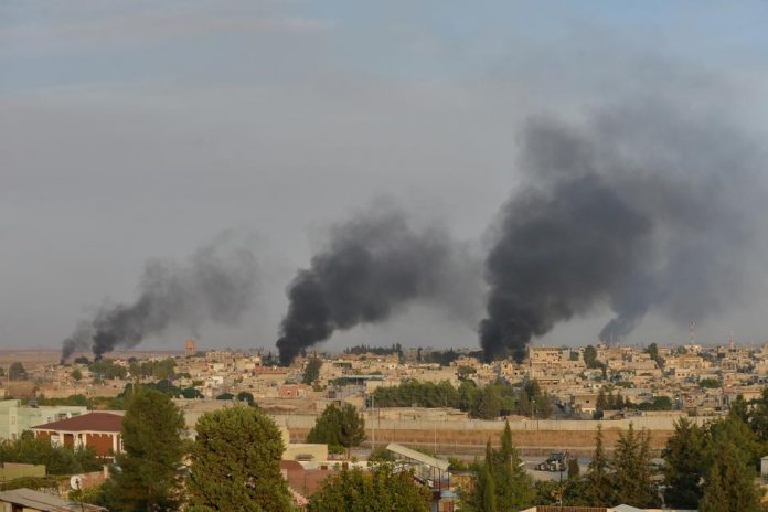 Turkey opens ground assault on Syria’s Kurds Smoke rises from the Syrian border town of Ras al-Ain on Oct. 9. REUTERS/STRINGER