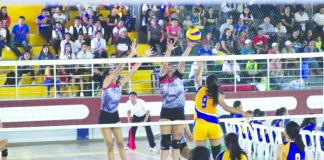 Iloilo province players block a shot by a Capiz player during this year’s Western Visayas Regional Athletic Association Meet (WVRAA) secondary girls volleyball match in Roxas City, Capiz on Feb. 18. The provincial government of Aklan, host of next year’s WVRAA Meet, already started its preparations for the event. CAPIZ AKSYON NEWS CENTER