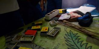 Police seized these boxes containing spiders, bet money and sticks from 22 persons engaging in a “spider derby” in Barangay Guzman-Jesena, Mandurriao district. IAN PAUL CORDERO