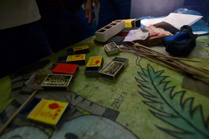 spider derby 1 Police seized these boxes containing spiders, bet money and sticks from 22 persons engaging in a “spider derby” in Barangay Guzman-Jesena, Mandurriao district. IAN PAUL CORDERO