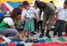 2 Antique towns get free medical, dental services A girl chooses a pair of slippers during the medical and dental information caravan of the Provincial Task Force to End Local Communist Armed Conflict in Barangay Pandanan, Valderrama, Antique. PIA6/T.VILLAVERT