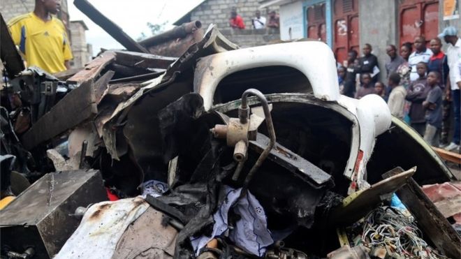 Civilians gather at the site where a plane operated by a local company crashed into a densely populated neighborhood in Goma, eastern Democratic Republic of Congo on Nov. 24. REUTERS/FISTON MAHAMBA