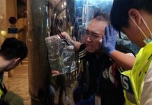 Andrew Chiu Ka-yin receives first aid after he was attacked in Hong Kong on Nov. 3. REUTERS