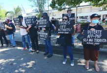 Activists in Iloilo City protest what they describe as “de facto martial rule” in Negros Island, Samar and the Bicol Region due to President Rodrigo Duterte’s Memorandum Order No. 32 that bolsters the deployment of government troops in the three areas wrecked by violence. IAN PAUL CORDERO/PN