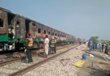 At least 46 killed in Pakistan train fire People and rescue workers gather near the site after a fire broke out in a passenger train and destroyed three carriages near the town of Rahim Yar Khan in Pakistan on Oct. 31. REUTERS/STRINGER