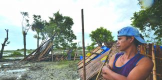 This man looks at the ruins of his house that was destroyed when a tornado ripped through Barangay Dawis Norte, Zarraga, Iloilo on Thursday. IAN PAUL CORDERO