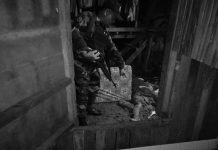 Man stabbed, hacked to death An officer points at the lifeless body of resident Lito Bawa-an, who was hacked and stabbed to death, in Barangay San Jose, Sipalay City, Negros Occidental on Nov. 21. SIPALAY CITY POLICE STATION