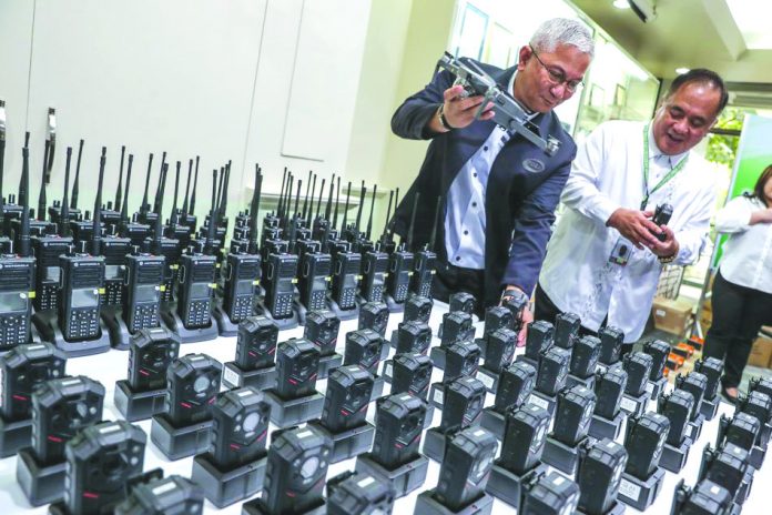 Body cams In this 2018 photo, Philippine Drug Enforcement Agency chief Aaron Aquino inspects body cams and other equipment for use in the government’s campaign against illegal drugs. Vice President Leni Robredo says body cams are “indispensable.” ABS-CBN NEWS