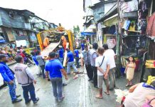 Demolition men help dismantle illegal structures that cause sidewalk obstruction along the road. The Department of the Interior and Local Government will implement a new 75-day road clearing operation to bolster government efforts to reclaim public roads. GMA NEWS