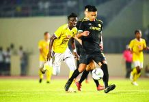 Ceres-Negros FC’s Dennis Villanueva controls the ball as a Kaya Futbol Club-Iloilo defender chases. KAYA-ILOILO PHOTO