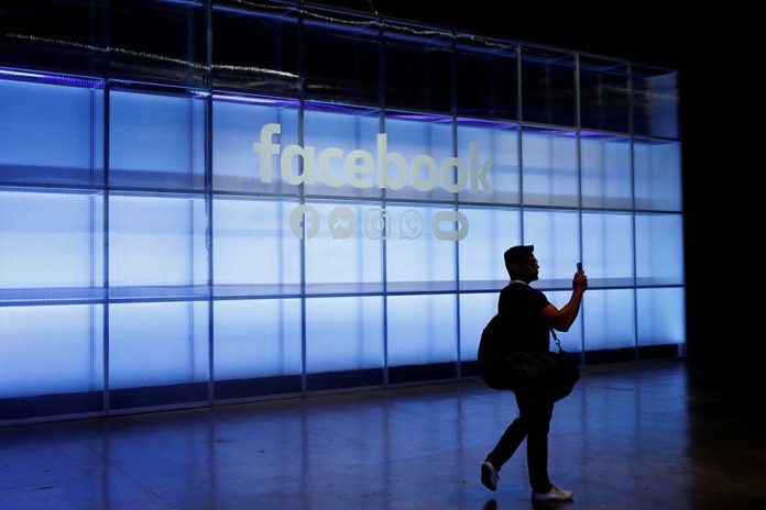 Facebook An attendee takes a photo of a sign during Facebook Inc.’s F8 developers’ conference in San Jose, California, United States, Apr.30. STEPHEN LAM/REUTERS