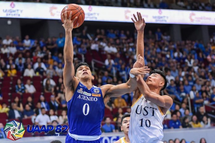 Ilonggo Ferdinand “Thirdy” Ravena of Ateneo Blue Eagles wards off the defense of Rhenz Abando of University of the Santo Tomas Growling Tigers for an inside hit. UAAP PHOTO