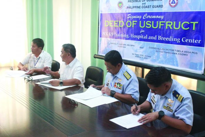 Guimaras soon to house K9 breeding, training facility Governor Samuel Gumarin and commander of the Philippine Coast Western Visayas District Commodore Allan Victor Dela Vega sign the Deed of Usufruct on Nov. 11 at the Governor’s Conference Room, PEO Building, San Miguel, Jordan, Guimaras.