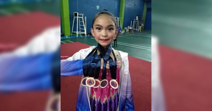 Gymnast Matthea Given Efenio Gymnast Matthea Given Efenio shows the medals she won for – Bacolod Tay Tung High School during the 39th NOPSSCEA.