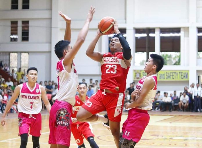 Hua Siong College of Iloilo Red Phoenix’s Reneil Gamboa is forced to a tough basket by the defense. PHOTO COURTESY OF WINMEL LEE