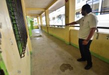 Two high school buildings have structural defects BUILDING IN DANGER. Iloilo City National High School administrative officer Khris Dane Dinopol points to huge indentations on the floor of this two-storey school building. The City Engineer’s Office has recommended that this building, built only in 2015 or four years ago, be vacated temporarily until the structural defect has been addressed. IAN PAUL CORDERO/PN