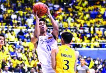 Ateneo mauls UST, nears UAAP 3-Peat Ilonggo Ferdinand “Thirdy” Ravena III of Ateneo Blue Eagles goes for a basket against University of Santo Tomas Growling Tigers’ Brent Paraiso. UAAP PHOTO