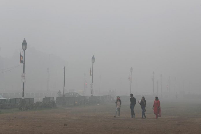People walk on a smoggy morning in New Delhi, India on Nov. 3. REUTERS/ADNAN ABIDI