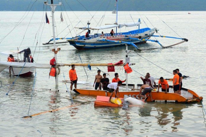 Coastguards salvage what remains of this motorboat that huge waves wrecked in the Iloilo Strait yesterday afternoon, Nov. 12, 2019. IAN PAUL CORDERO/PN