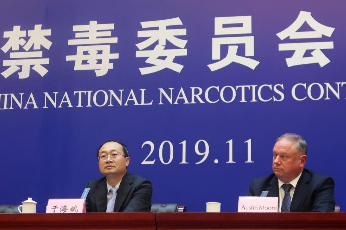 National Narcotics Control Commission official Yu Haibin attends a news conference with Austin Moore, an attache to China for the United States (US) Homeland Security Department, after a court sentence on people smuggling fentanyl to the US, in Xingtai, Hebei province, China on Nov. 7. REUTERS/HUIZHONG WU
