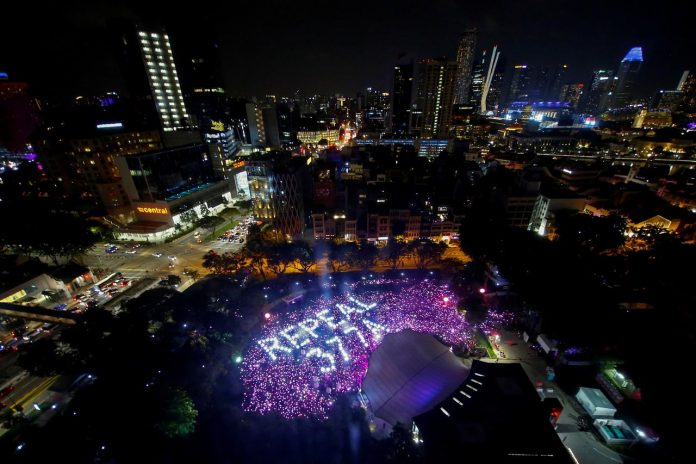 The participants at Pink Dot, an annual event organized in support of the lesbian, gay, bisexual, and transgender community, gather in formation to call for the repeal of Section 377A of the Penal Code in Singapore on June 29. REUTERS/FELINE LIM -/FILE PHOTO