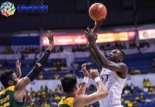 University of Santo Tomas Growling Tigers’ Soulemane Chabi Yo scores against two Far Eastern University Tamaraws defenders. UAAP PHOTO