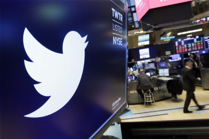 Twitter The logo for Twitter is displayed above a trading post on the floor of the New York Stock Exchange. In a policy published Friday, Twitter said it is banning ads that contain references to political content, including appeals for votes, solicitations of financial support and advocacy for or against political content. The ban also includes any ads by candidates, political parties, elected or appointed government officials. RICHARD DREW/AP