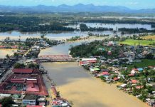 PAN-AY RIVER BURSTS. This aerial shot of Pontevedra, Capiz shows the Pan-ay River overflowing, its murky water engulfing residential and commercial areas of the municipality, and turning vast rice fields into instant rivers as well. Other towns in Capiz also reported flooding, prompting the provincial government to declare a state of calamity. IAN PAUL CORDERO/PN
