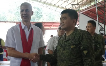 Army Colonel Inocencio Pasaporte (right), who assumed as commander of the 303rd Infantry Brigade based in Murcia, Negros Occidental on Dec. 12, meets Gov. Eugenio Jose Lacson after the change of command held at the brigade headquarters. PNA/NANETTE L. GUADALQUIVER