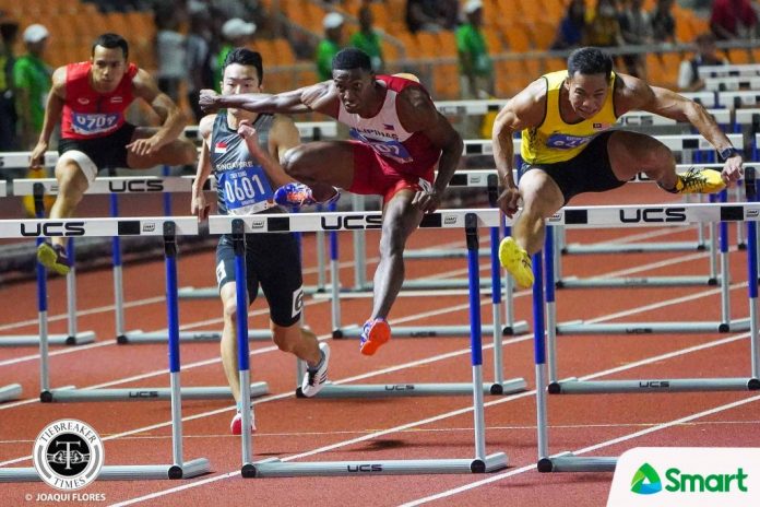 Clinton Bautista edges Malaysia’s Rayzam Shah Wan Sofian in a photo-finish men’s 100-meter hurdles. TIEBREAKER TIMES PHOTO