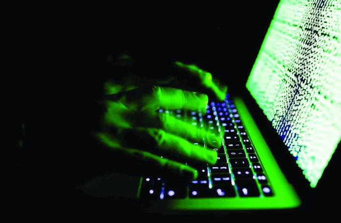 Cyber criminals A man types on a computer keyboard in front of the displayed cyber code. Cyber criminals are expected to target the financial industry – particularly financial technology such as mobile investment applications – in 2020, Russian cybersecurity firm Kaspersky said. REUTERS