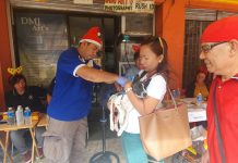 Dr. Ronald Lorenzo, rabies control coordinator of the Provincial Veterinary Office, injects a vaccine to a dog in Kalibo, Aklan on Tuesday. JUN AGUIRRE/PN