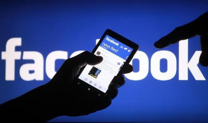 A smartphone user shows the Facebook application on his phone. Facebook Inc. dropped to the 23rd spot in Glassdoor’s list of “Best Places to Work” in 2020 from the seventh it had secured last year, amid heightened scrutiny of the world’s largest social network. REUTERS
