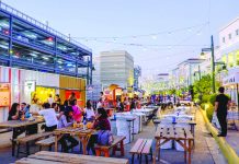 People are seen eating at a food park behind a mall in Iloilo City. MARCO VERCH